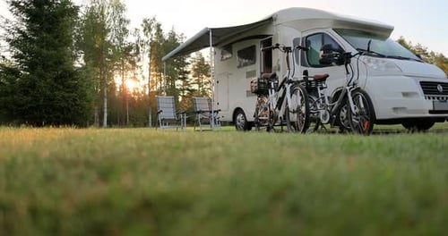 Camper Van and Bicycles at a Picturesque Campsite