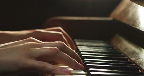 Close Up Playing Vintage Grand Piano Indoors