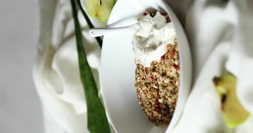 Vertical video rotation of morning granola breakfast with greek yougurt