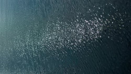 Sparkling Sunlight on Deep Blue Ocean Water