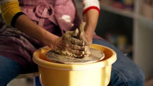 Close Up Hands in Clay Modeling Studio Young Girl Hands Giving Shape to Clay on a Potter's Wheel