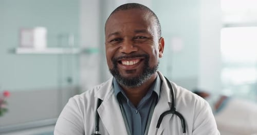 Healthcare, doctor and face of black man at hospital with smile for support, service and wellness