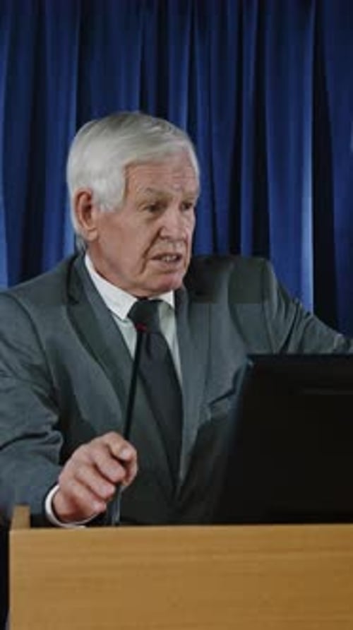 Man Giving a Speech at a Podium