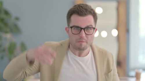 Angry Man Yelling and Pointing at Camera