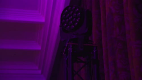 Magenta Wash From Par Light Flooding Ornate Ceiling and Stage Corner Subtle Haze Beams Cutting