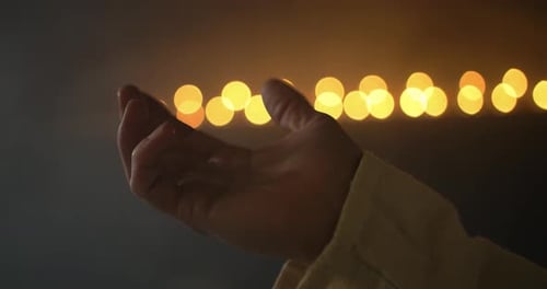 Closeup of Hand Lifted in Worship, Praying, Christianity, Religion