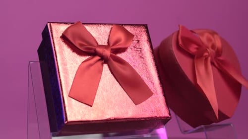 Two Red Gift Boxes For Valentines Day on PInk Background. Close Up
