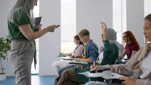 University Students with Teacher Studying Indoors, Lesson in Classroom