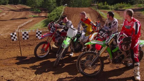 Motocross Racers on Dirt Bikes Before Race