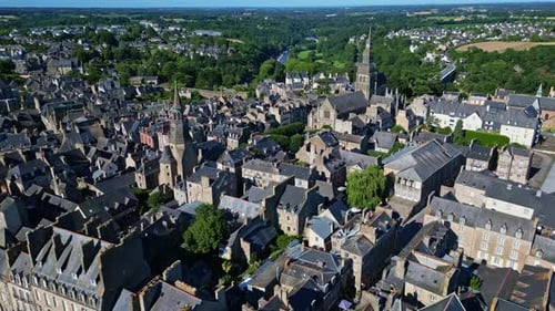 Tour de l'Horloge or Clock Tower and Saint Sauveur basilica, Dinan, France. Aerial drone sideways