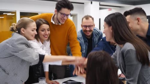 Happy Team Celebrates Success in Modern Office