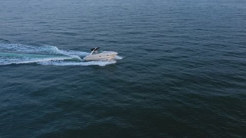 Aerial view to a luxury motor yacht floating in sea