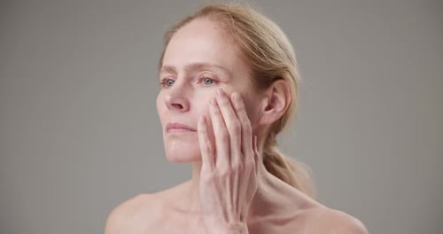 Adult Woman Touching Face in Close Up