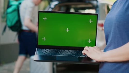 Person with Portable Computer Having Isolated Template Mock Up Display