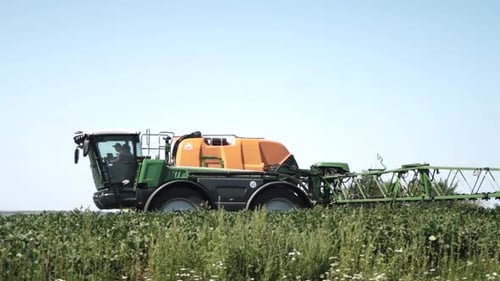 Spray Fertilize On Field With Chemicals In Agriculture Field