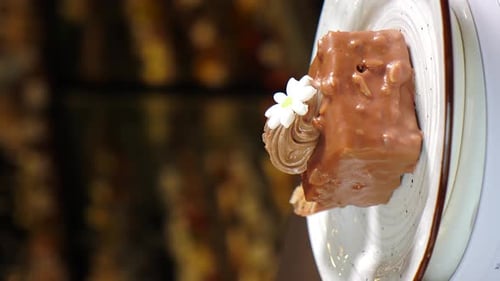 Chocolate Cake with Icing Rotating on Stand Dark Background Sweets and Desserts Vertical Footage