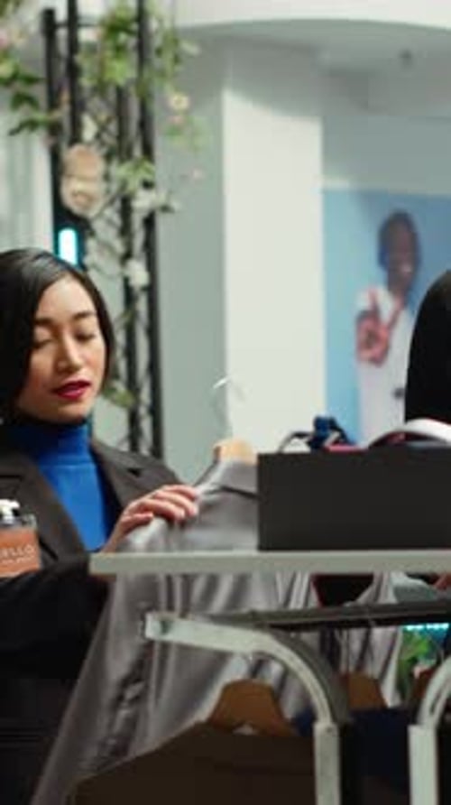 Vertical Video Diverse People Discussing About Fashion Trends and Assortments in a Retail Store