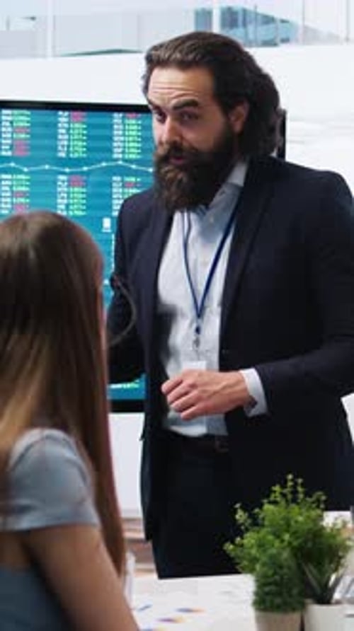 Vertical Video Financial Adviser Presents Market Analytics to Clients Using Large Screen