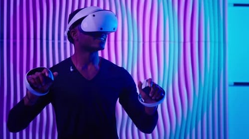Young Man Using VR Headset in a Futuristic Room