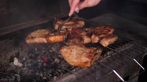 A Closeup of a Juicy Steak is Grilled in the Evening