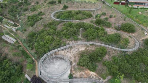 Winding Alpine Coaster Track in Green Landscape