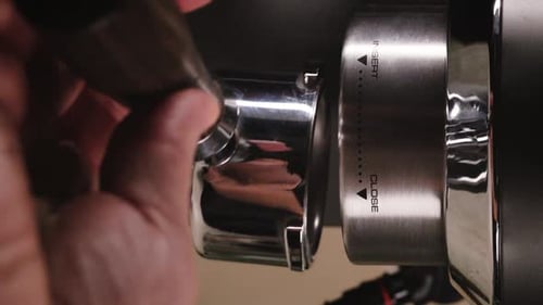 Barista Making Coffee with Espresso Machine From the Bottom