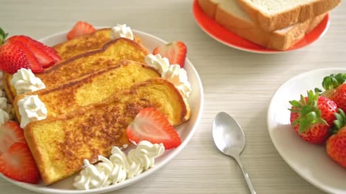 homemade french toast with fresh strawberry and whipping cream