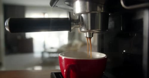 Footage B Roll of Pouring Coffee Stream From Machine in Cup Home Making Hot Espresso Using Filter