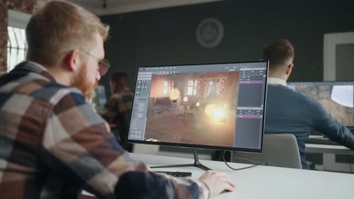 Professional Programmers Creating New Video Games in Office Group of Game Designers Working