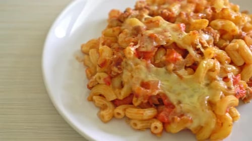 homemade baked macaroni bolognese with cheese - Italian food style