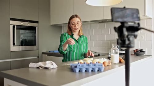 Woman Making Dough and Recording in Kitchen