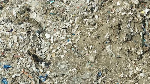 A large pile of concrete debris and construction waste.