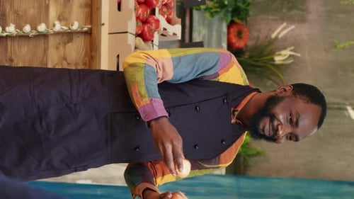 Man Selecting Fresh Onions at Farmers Market