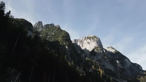Majestic mountain peaks under a clear sky showcasing natural beauty in a serene landscape