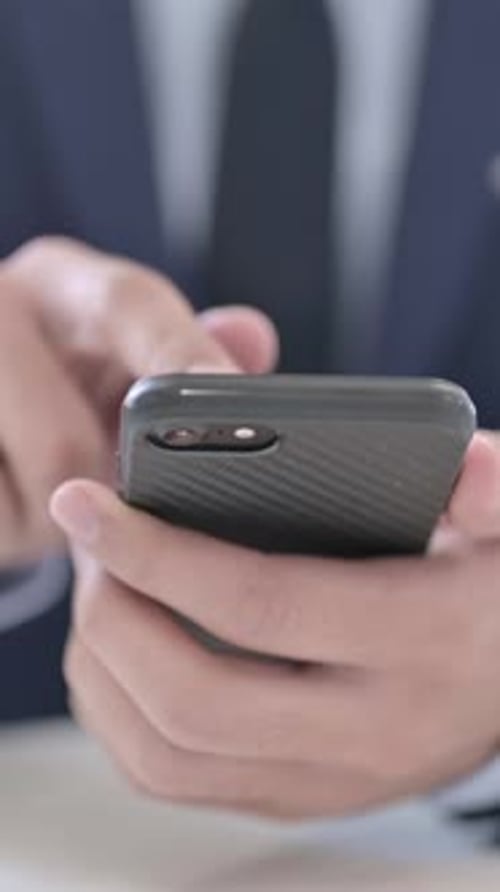 Close Up Businessman Using Smartphone, vertical video