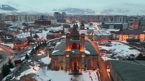 Aerial View of Illuminated Madrasa in Winter Cityscape
