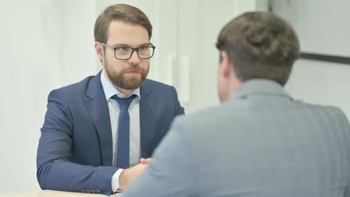Businessman Talking with Customer in Office