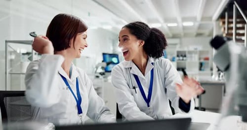 Scientist, women and high five at lab with laptop, excited and solution with study results