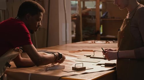 Young Diverse Tanners Working Together in Workshop