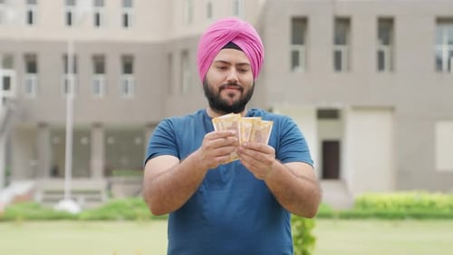 Man Counting Money Outdoors