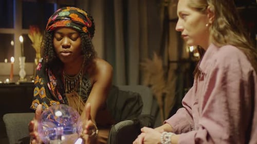 Fortune Teller Answering Questions with Help of Crystal Ball