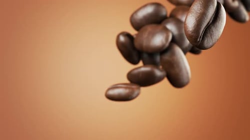 Coffee beans for your advertising. Slow-motion falling coffee beans close-up. Coffee beans for your