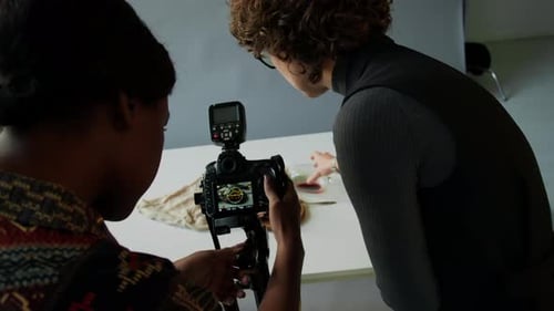 Food Stylist Helping Photographer during Studio Shoot