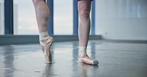 Pointe shoes, feet and ballerina in studio for stretching with rehearsal, practice or performance