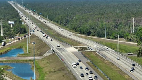 Aerial View of American Freeway with Many Driving Cars During Rush Hour in Florida View From Above