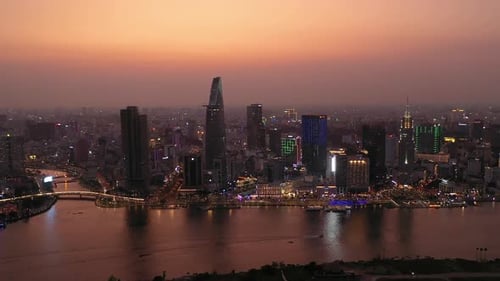 Ho Chi Minh City, Vietnam iconic Skyline and Saigon river waterfront aerial panorama on a busy eveni