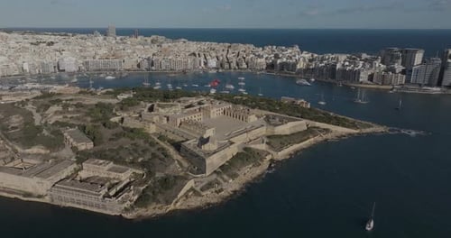 Aerial view of historic fort overlooking city and harbor, Valletta, Malta.