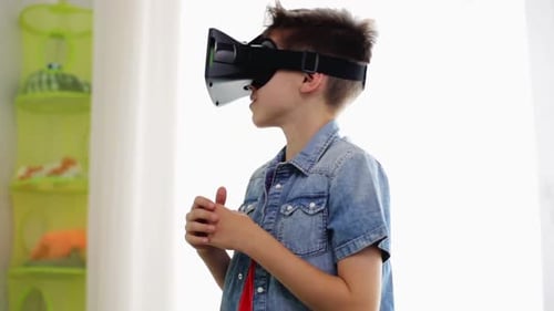 Boy Wearing VR Headset Exploring Virtual Reality at Home