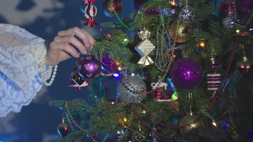 Elegant Hand Decorating Christmas Tree with Bauble