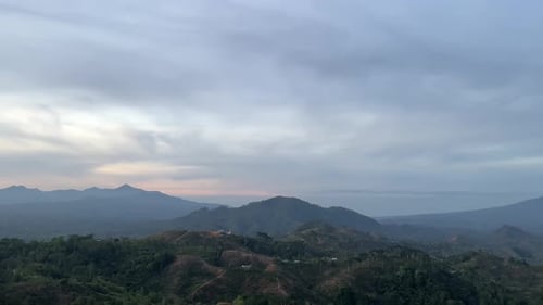 Aerial View of Forested Mountains at Sunset